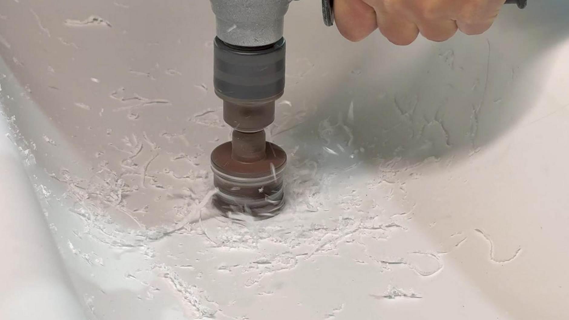 A Solid Surface washbasin being punched, with the flakes floating like snowflakes.1